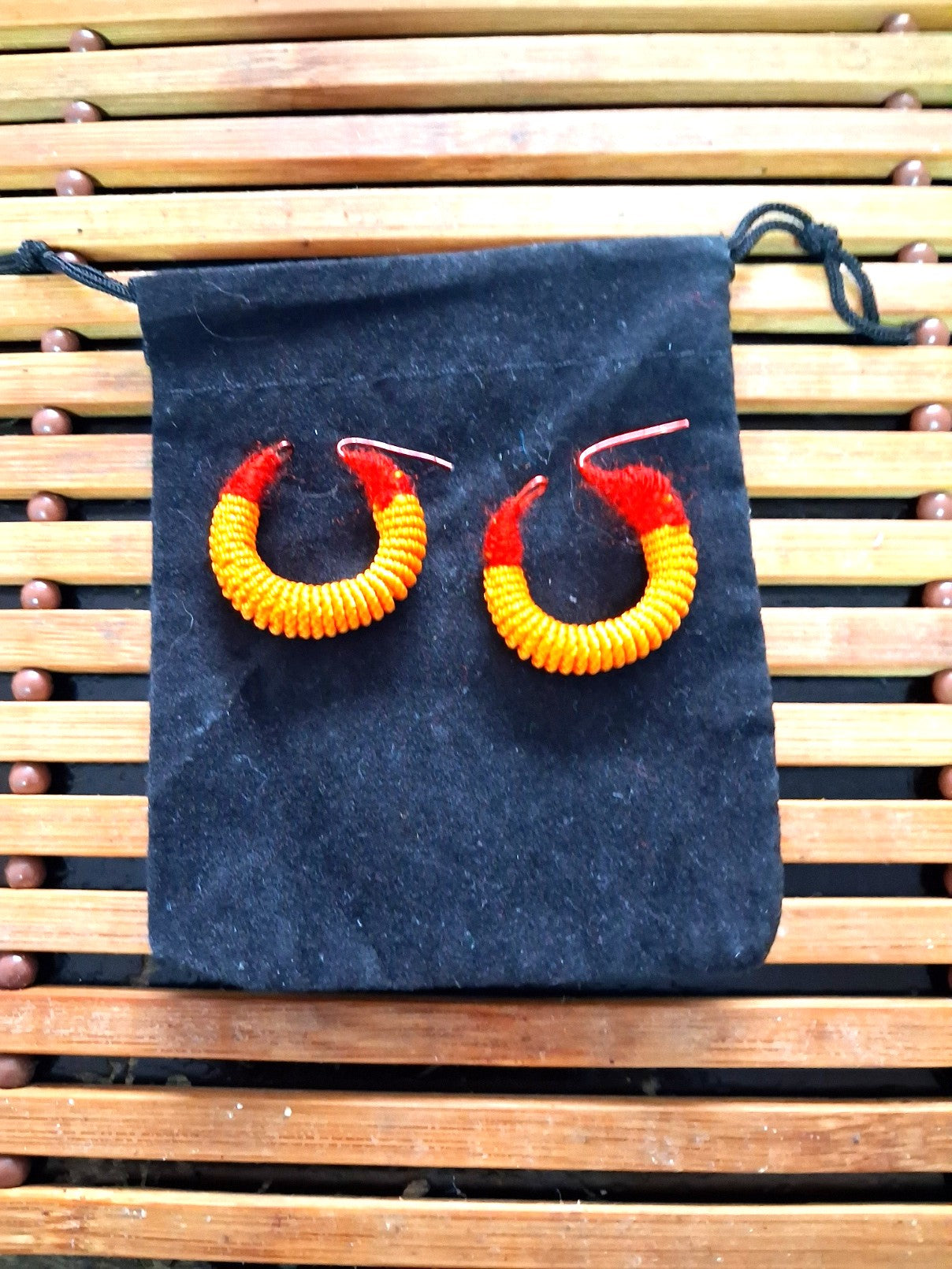 Small traditional red and yellow Malian thread earrings