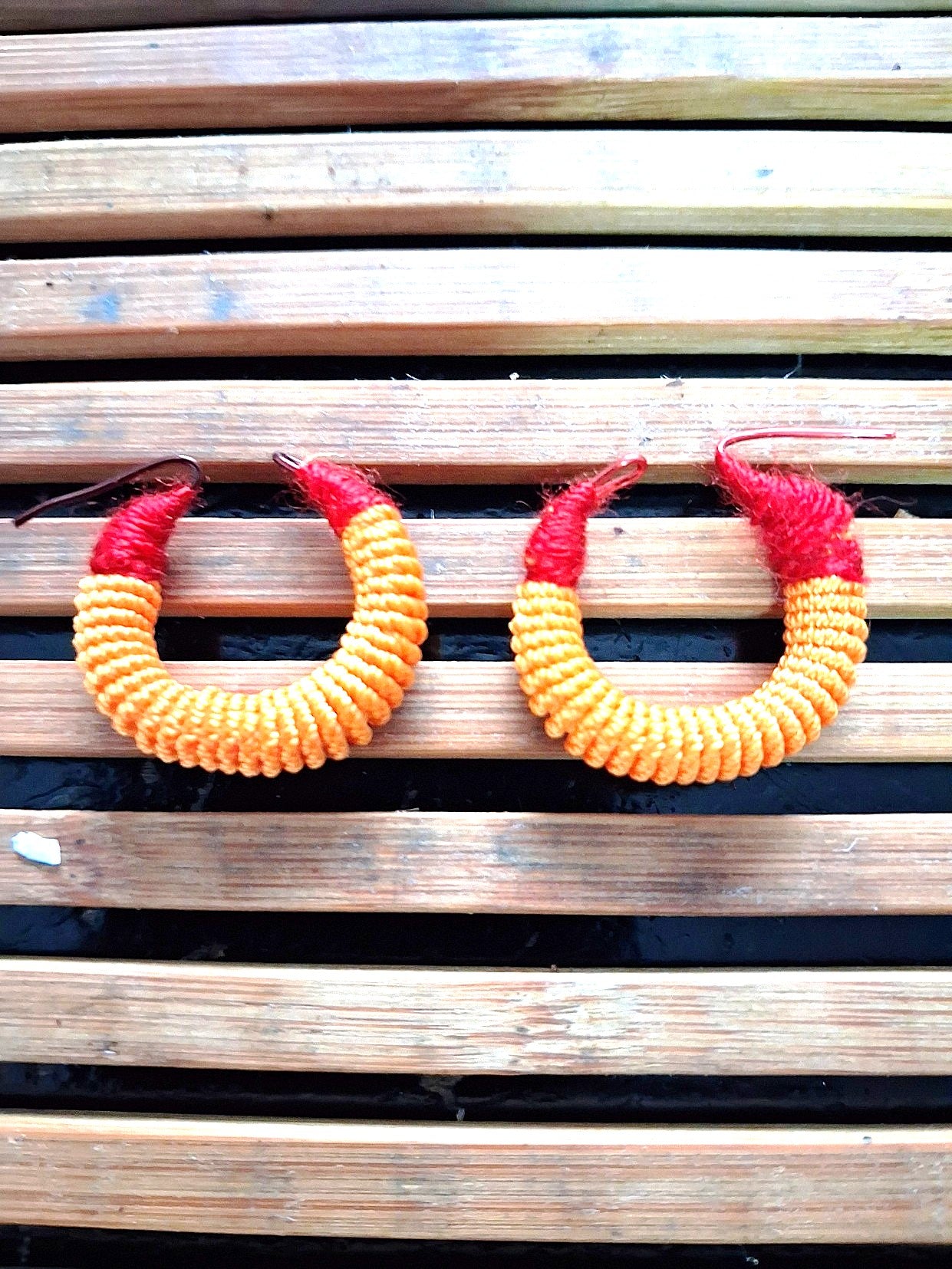 Small traditional red and yellow Malian thread earrings
