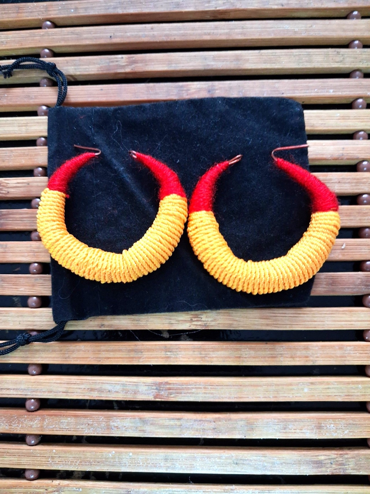 Large traditional red and yellow Malian thread earrings