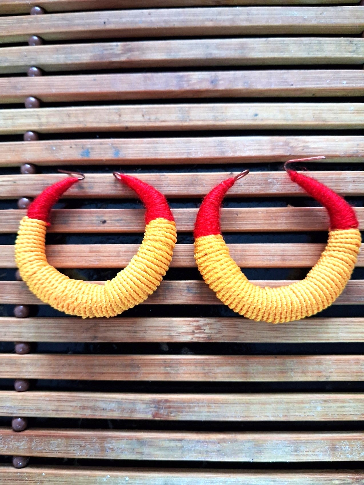 Large traditional red and yellow Malian thread earrings